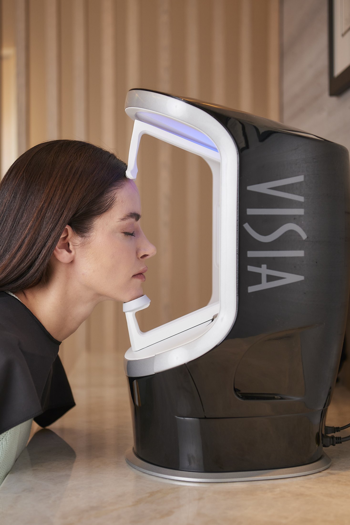 Model demonstrating VISIA facial imaging at Aesthetica in Scottsdale